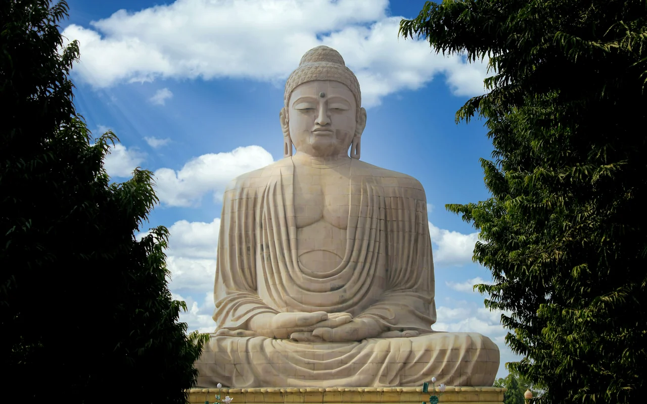 The 25-metre Great Buddha statue seated against a blue sky at Bodh Gaya, Bihar