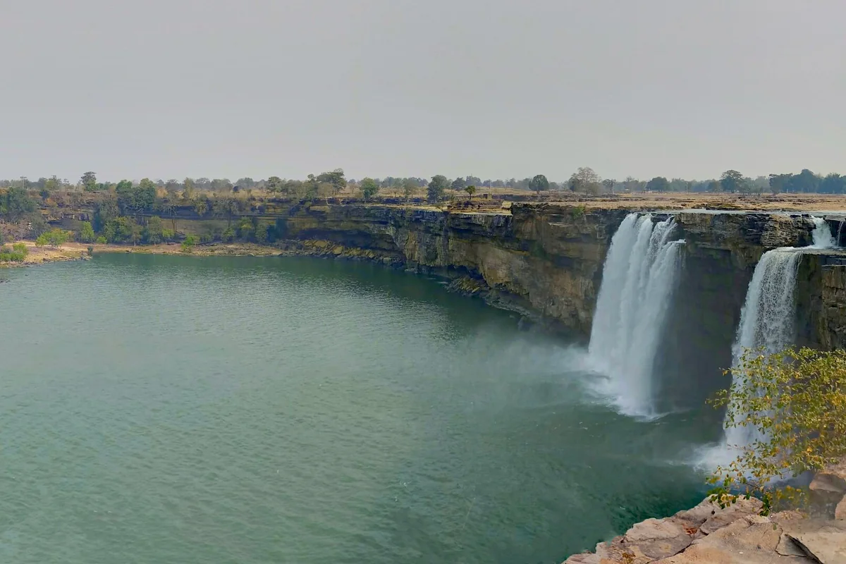 Chitrakote Falls reduced to two narrow channels above a green pool in the dry season