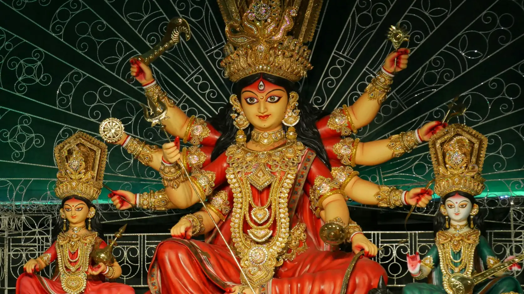 Durga on her lion with Lakshmi and Saraswati on either side, at the Ballygunge Cultural Association puja in Kolkata