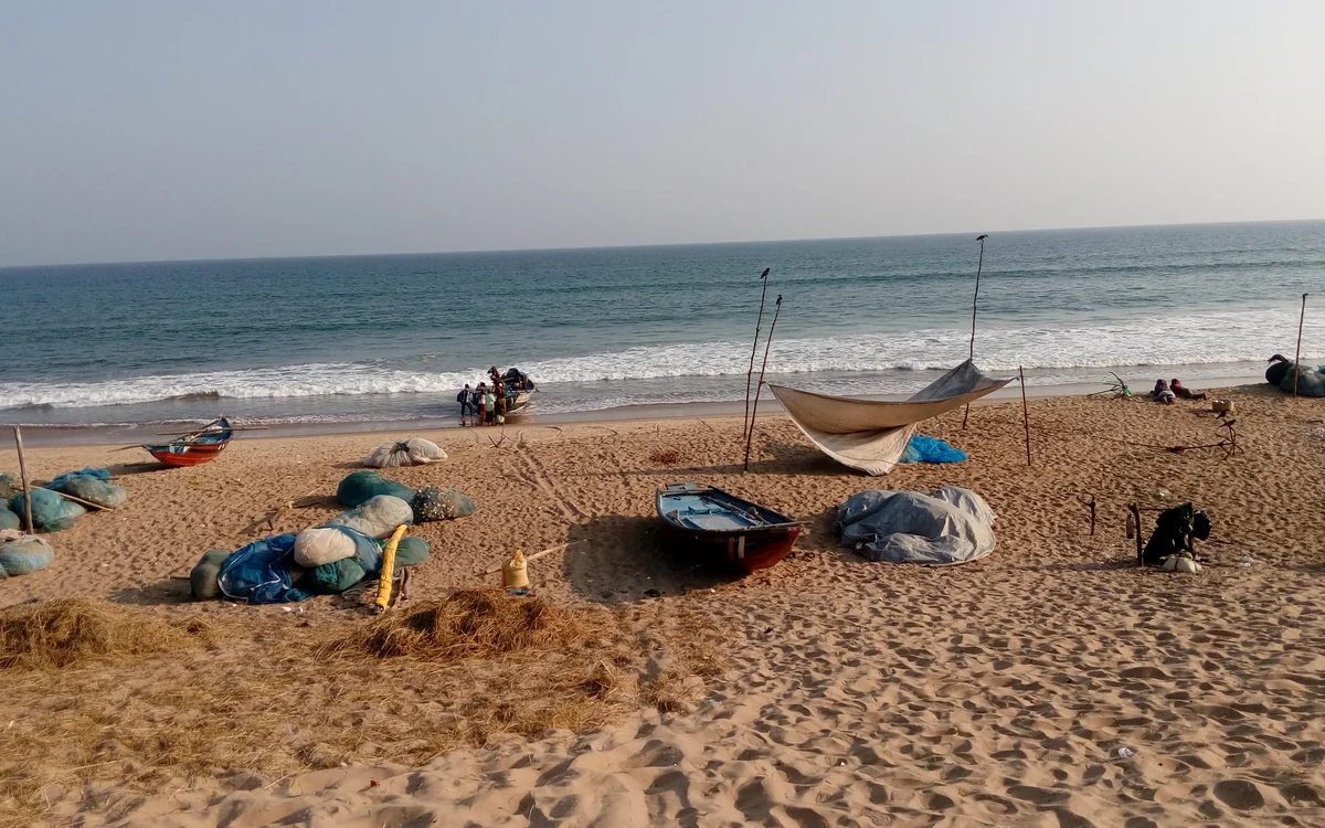 The wide sandy beach with fishing boats at Gopalpur-on-Sea, Ganjam, Odisha