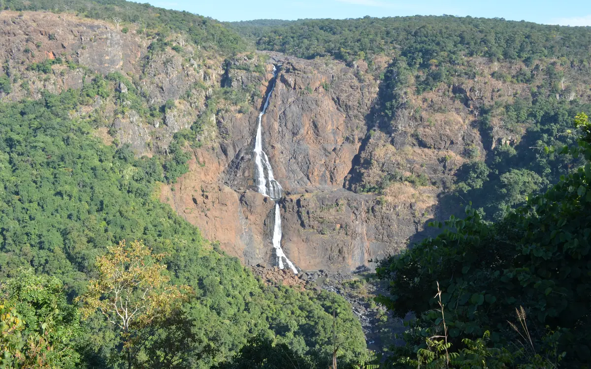 The Barehipani waterfall dropping through forested hills in Similipal, Odisha